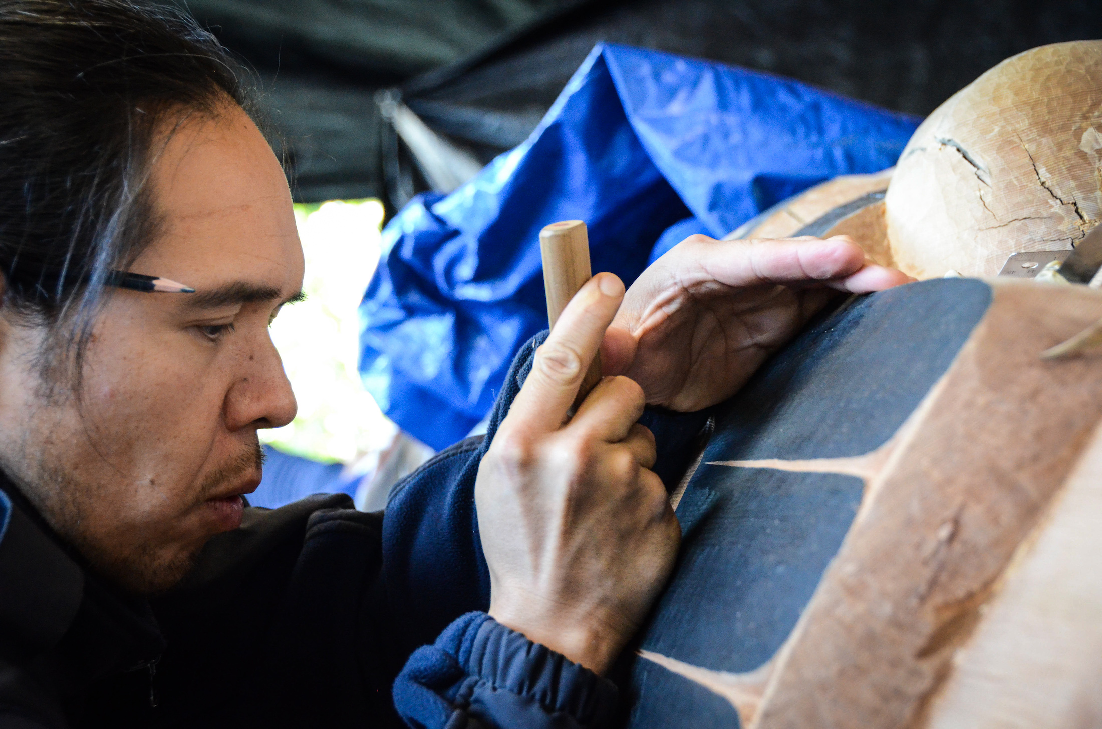 Ian Reid (Nusi) working on a totem pole. Photo: Heiltsuk First Nation
