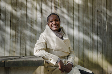 Annamie Paul sitting at a picnic table outside