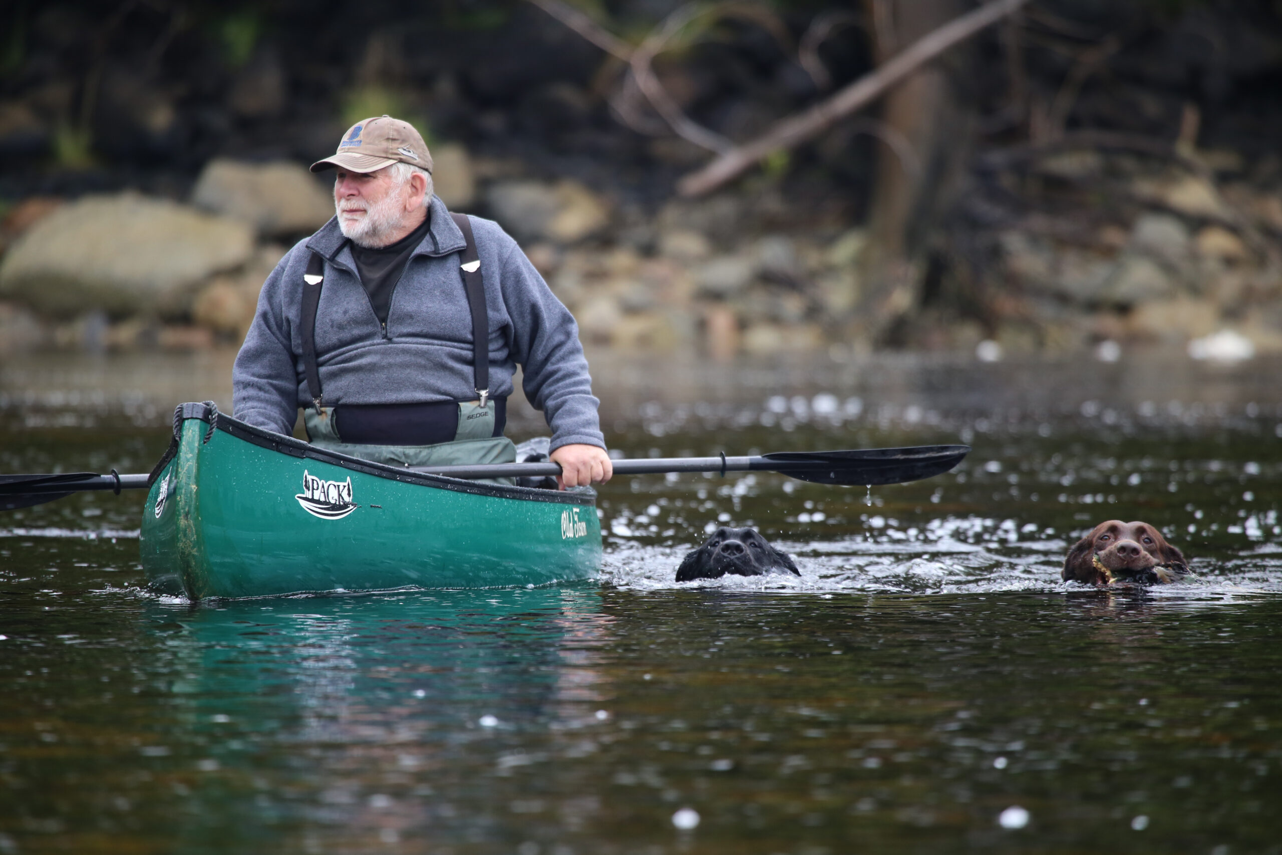 Doug Stewart in a canoe in a river