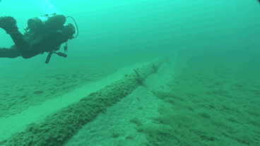 A diver inspects the underwater Line 5 pipeline