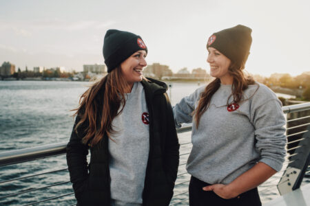 emma gilchrist and carol linnitt smiling at each other