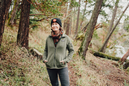 sarah cox posing in a forest