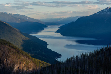 Kootenay Lake with mountain slopes on either side