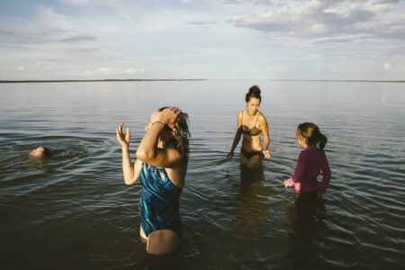 women standing in water