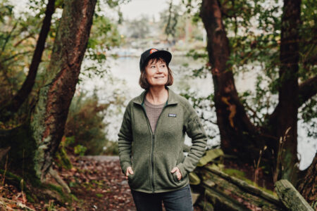 sarah cox posing in a forest