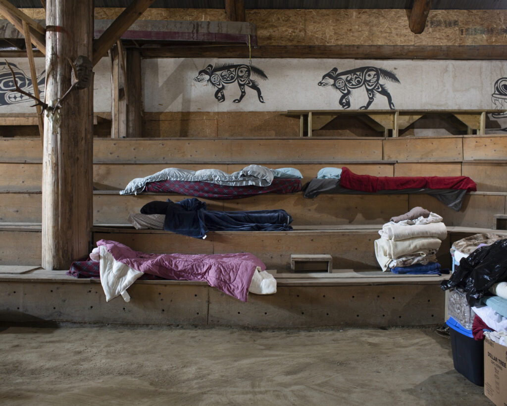 sleeping bags and towels in long house
