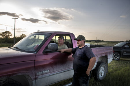 Manitoba drought: Cam Johnson and his father Tom on their farm in Oak Point Manitoba. Photo: Aaron Vincent Elkaim / The Narwhal