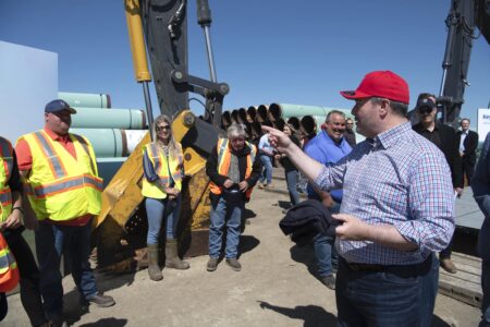 Alberta Premier Jason Kenney greets workers in Oyen, Alta, in July 2020 after announcing the provincial government's financial support of Keystone XL.