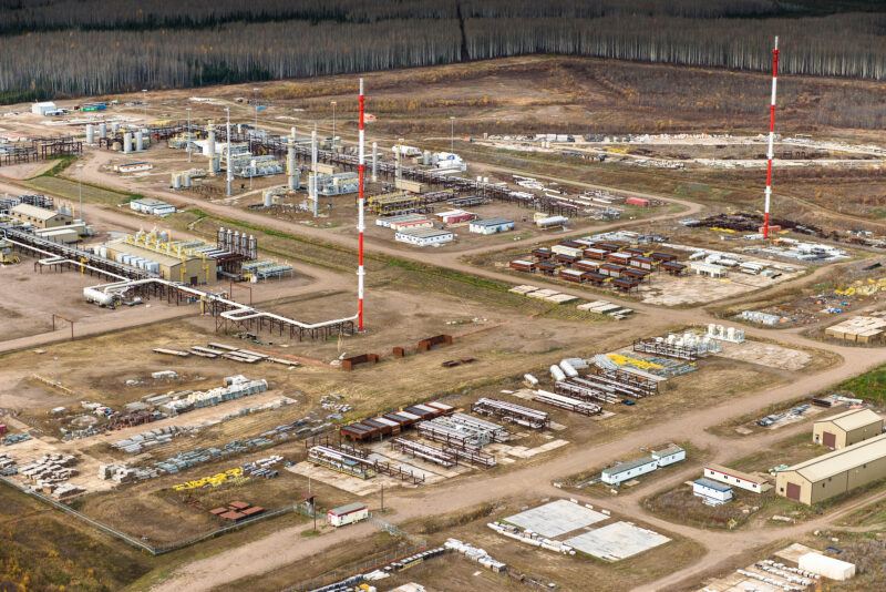 a landscape of pipes and oil and gas infrastructure seen from the air