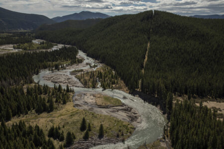 cutline running along mountain beside river