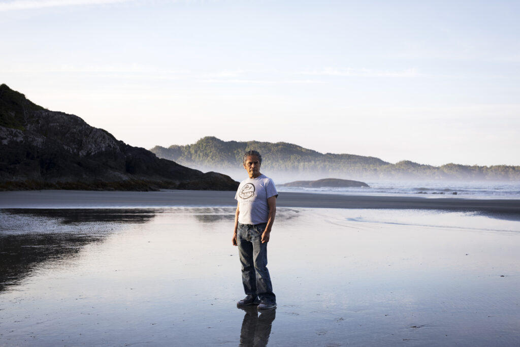 Joe Martin poses for a portrait on Chesterman Beach