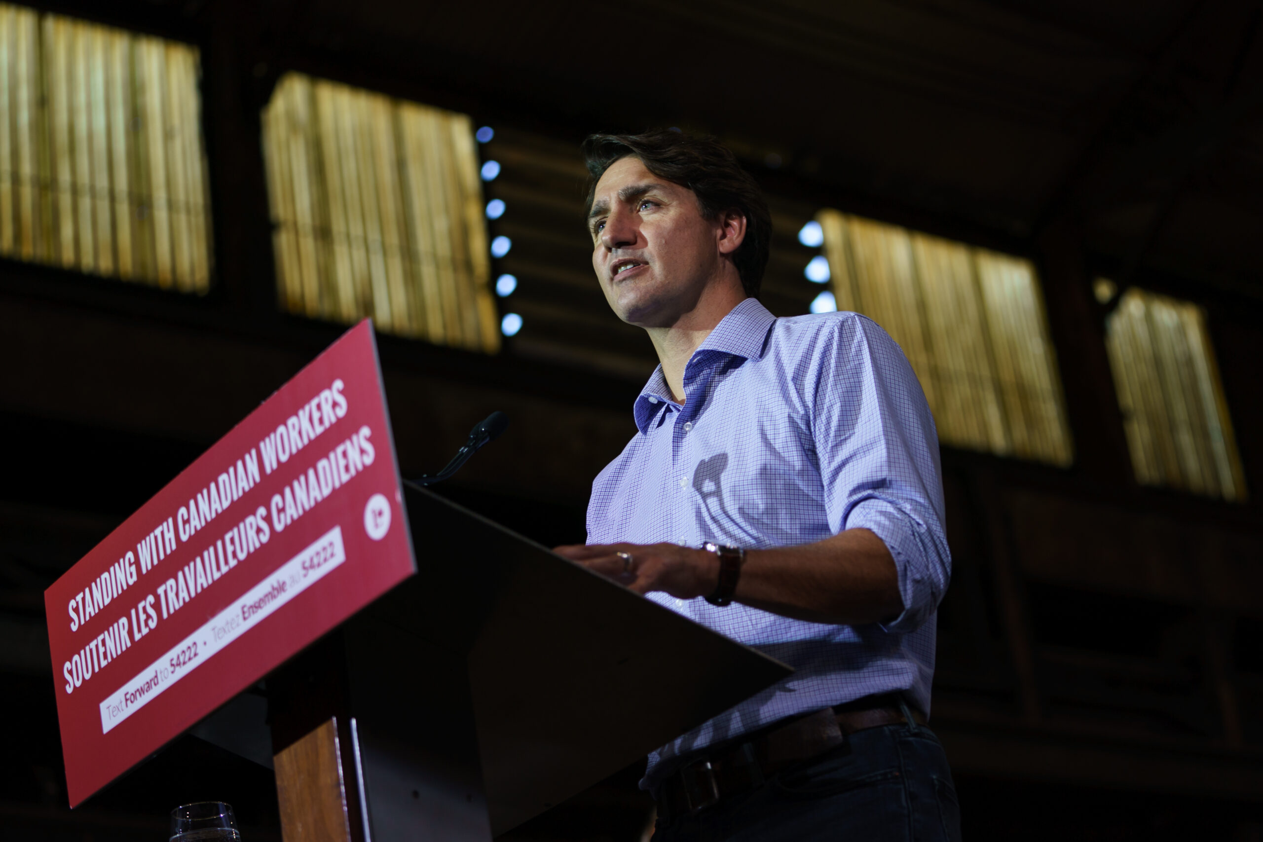 justin trudeau speaking at a podium