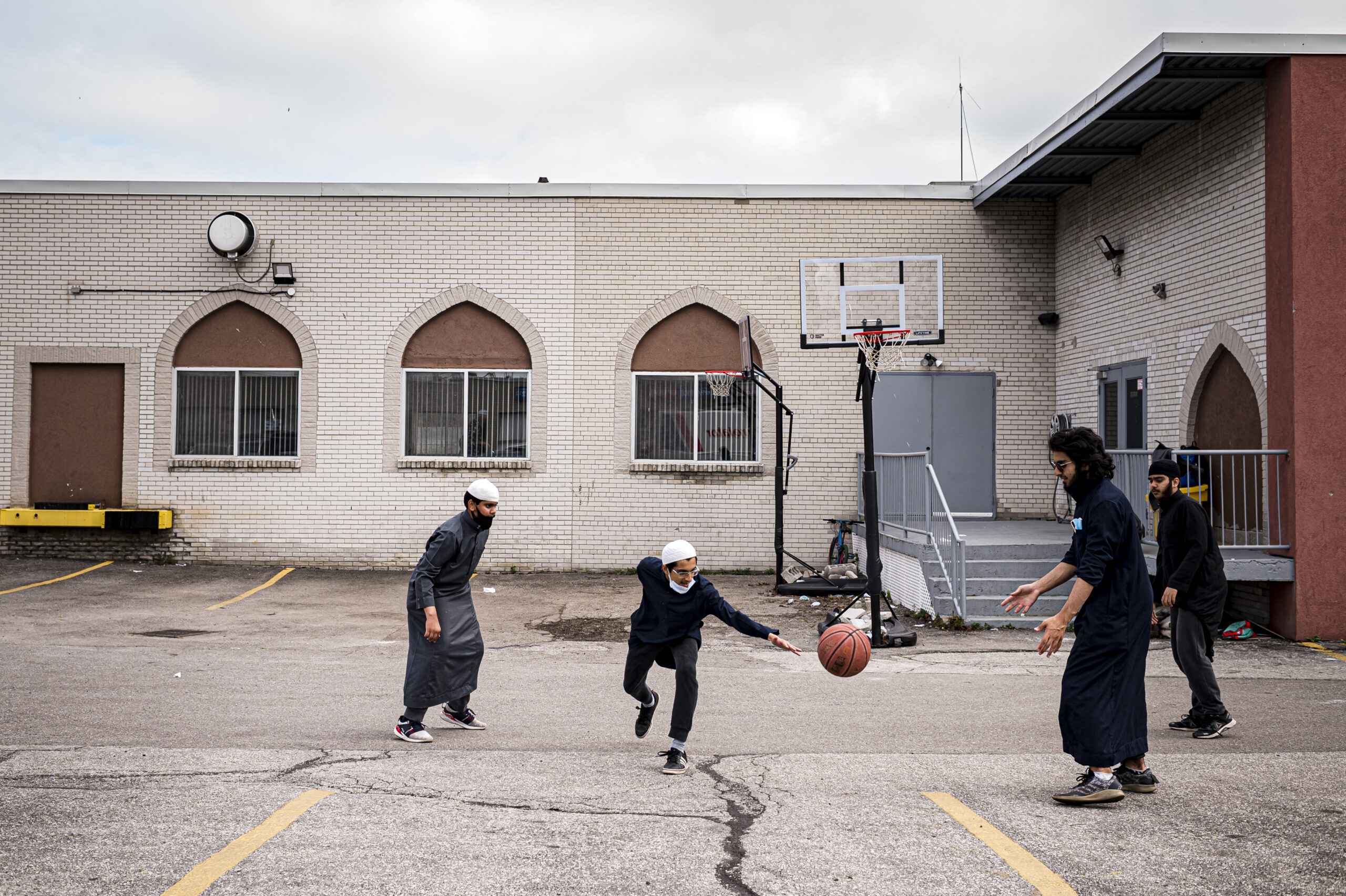 Youth shoot hoops before school and prayer at the Masjid Dar-us-salam Islamic Centre 