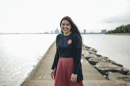 Fatima Syed poses for a portrait by water