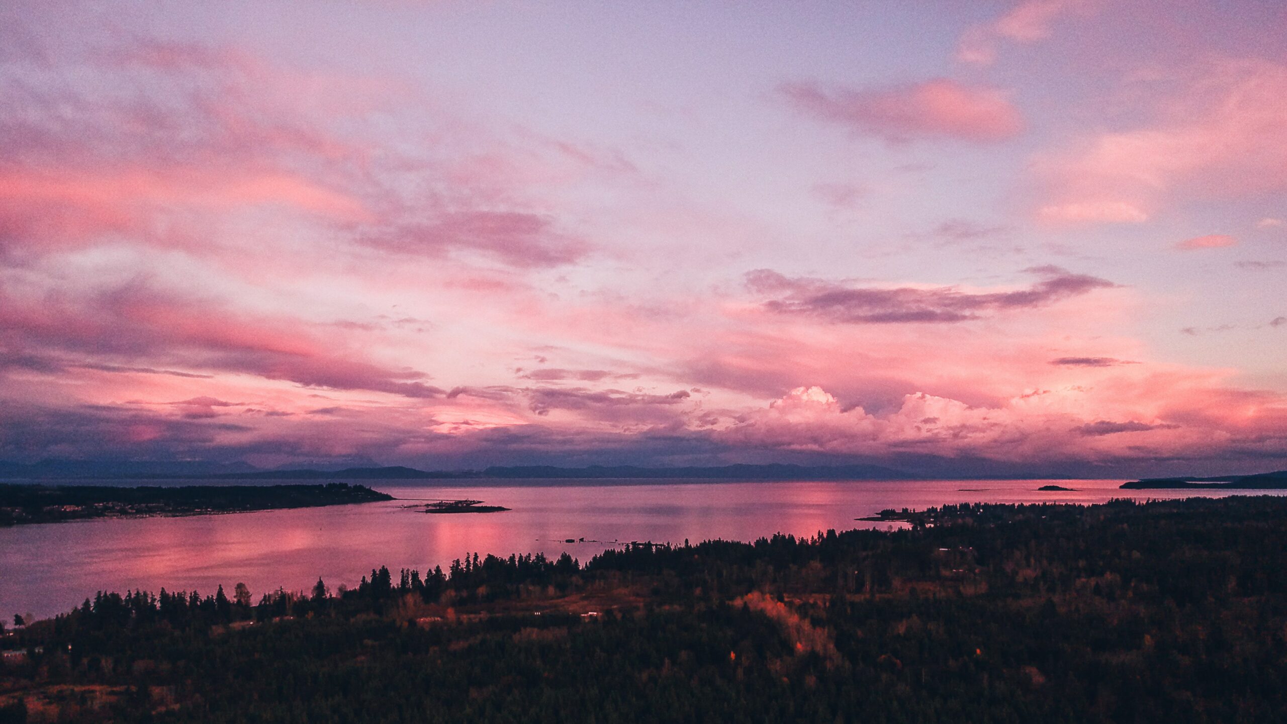 An aerial view of a pink sunset over the Comox Valley