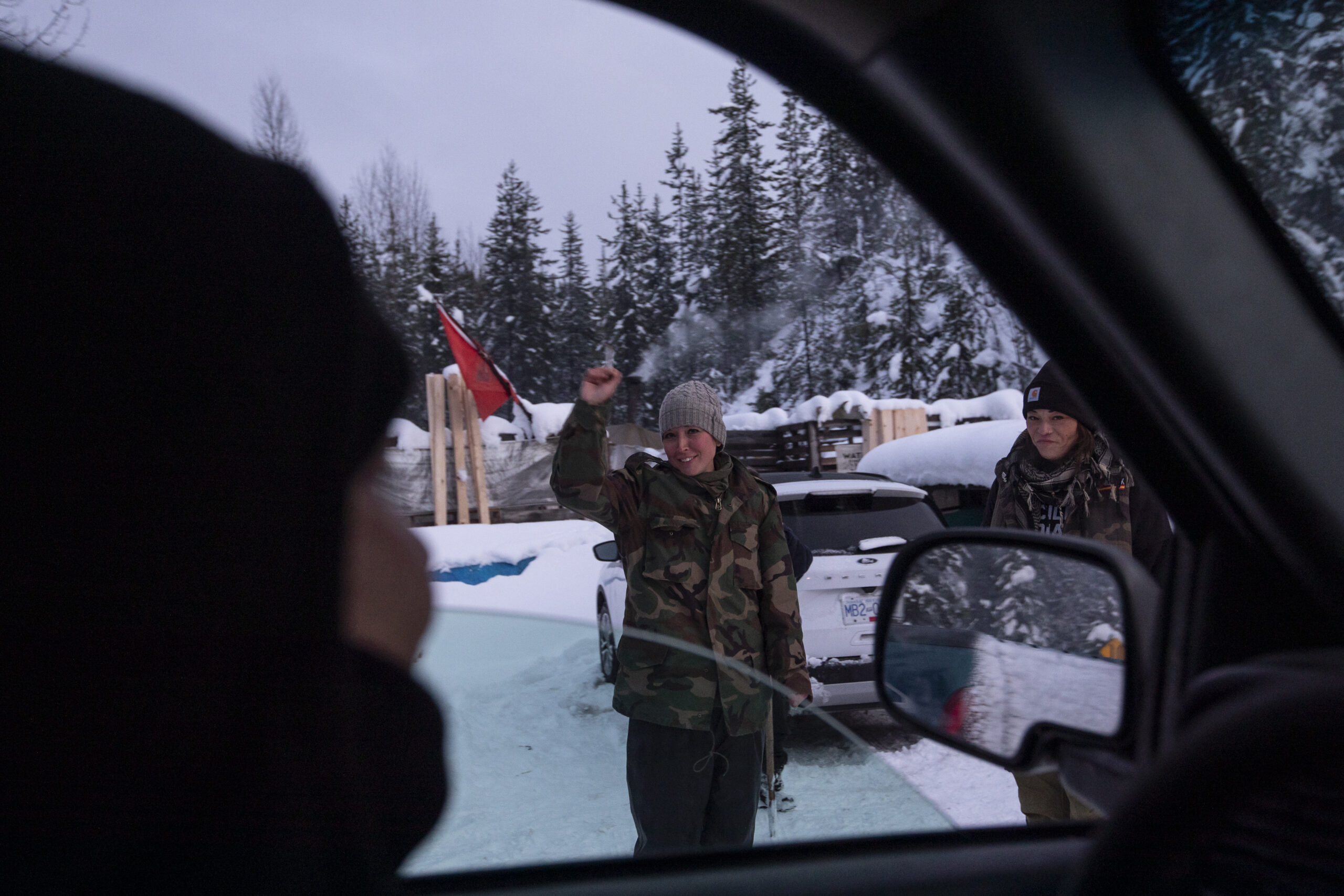 Molly Wickham stands at a blockade in the snow