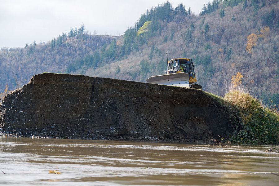 The Sumas dike in Abbotsford, B.C. was repaired after flood damage and the government plans to build bigger dikes to prepare for future floods — part of an approach some say is "totally wrong." Photos: City of Abbotsford / Twitter