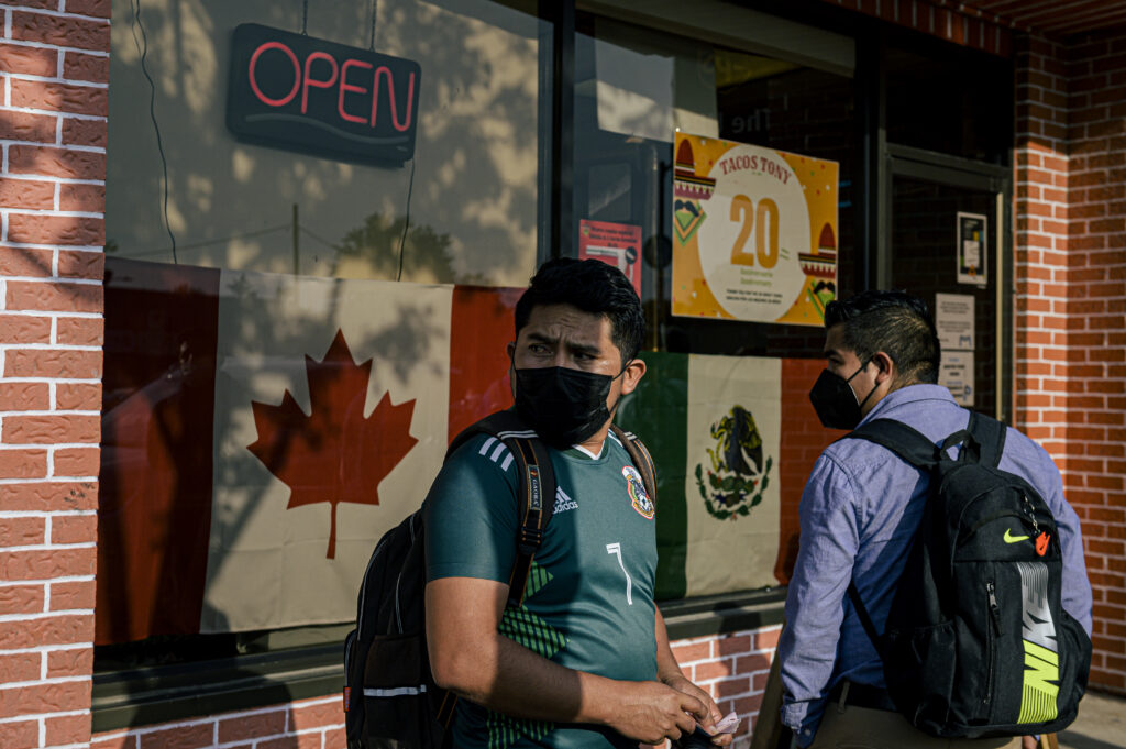 A photo of migrant workers in downtown Leamington.
