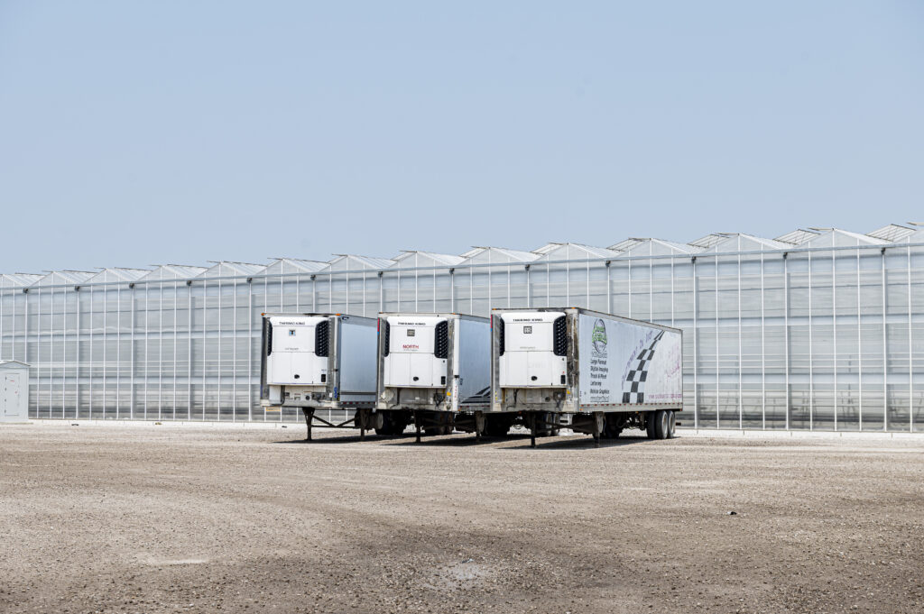 Trucks outside a greenhouse in Leamington, Ont.