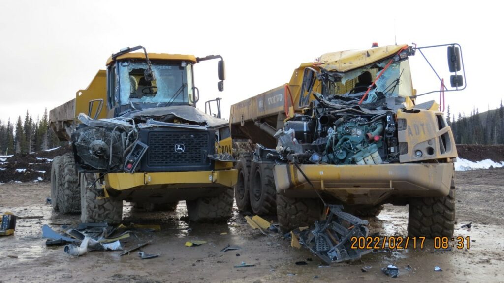 Two damaged dump trucks at a Coastal GasLink work site