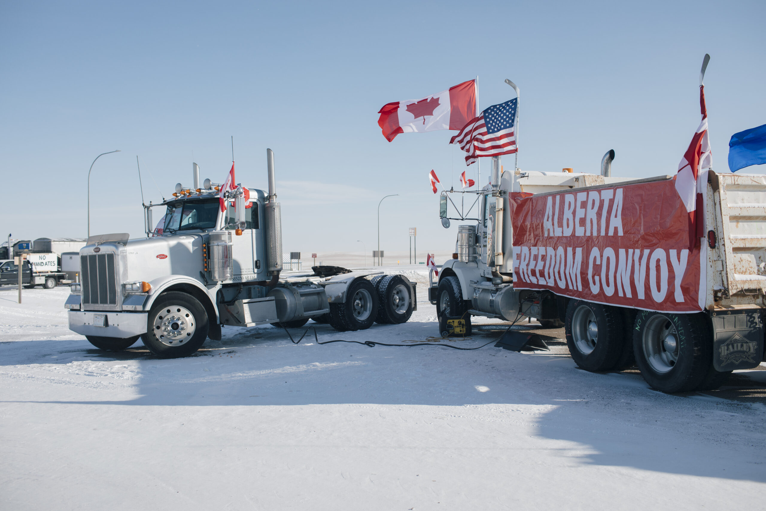 Trucks block the border crossing near Coutts, Alta., while demanding an end to vaccine mandates.