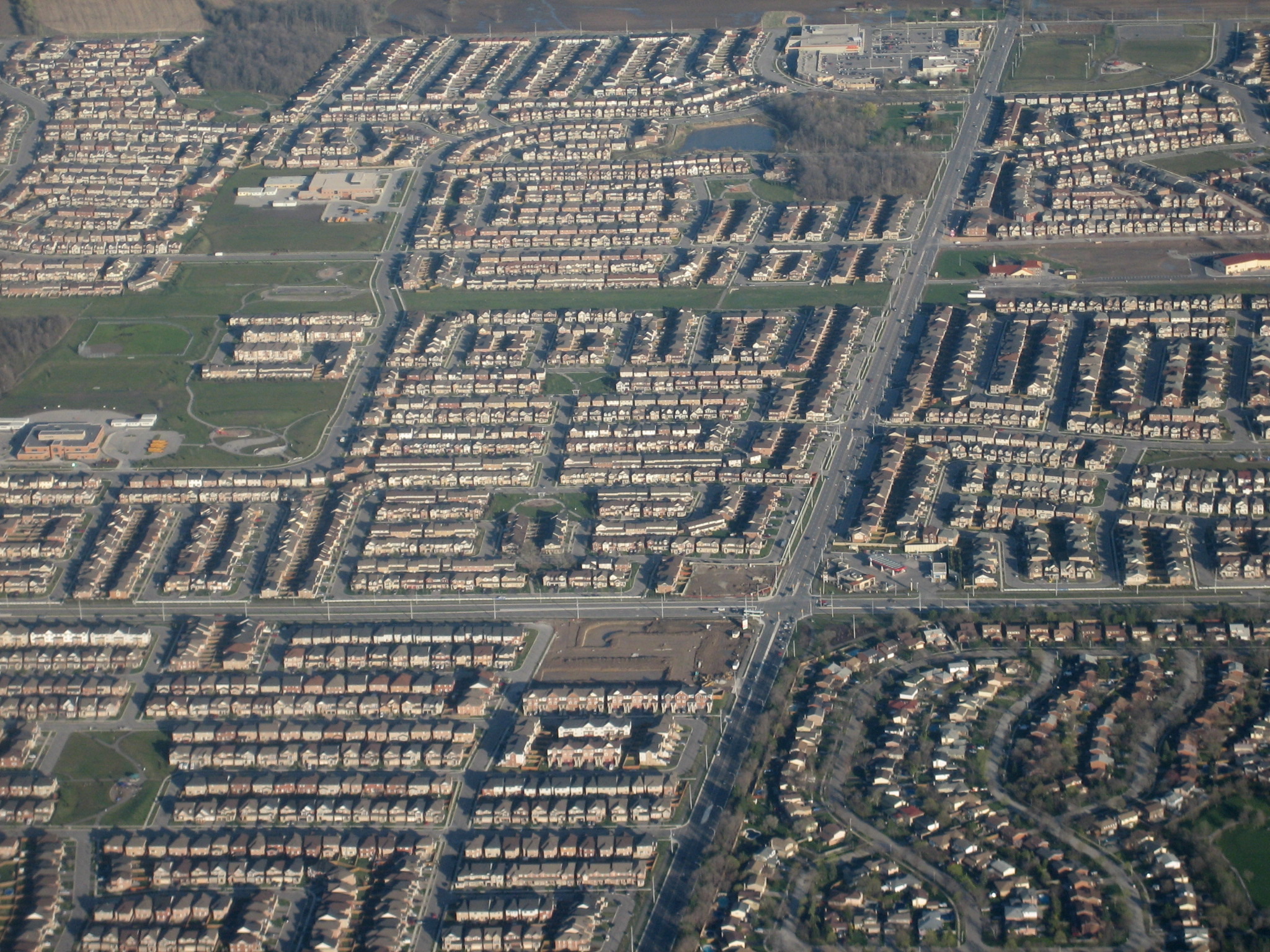 An aerial view of rows of houses in the suburbs of Milton.