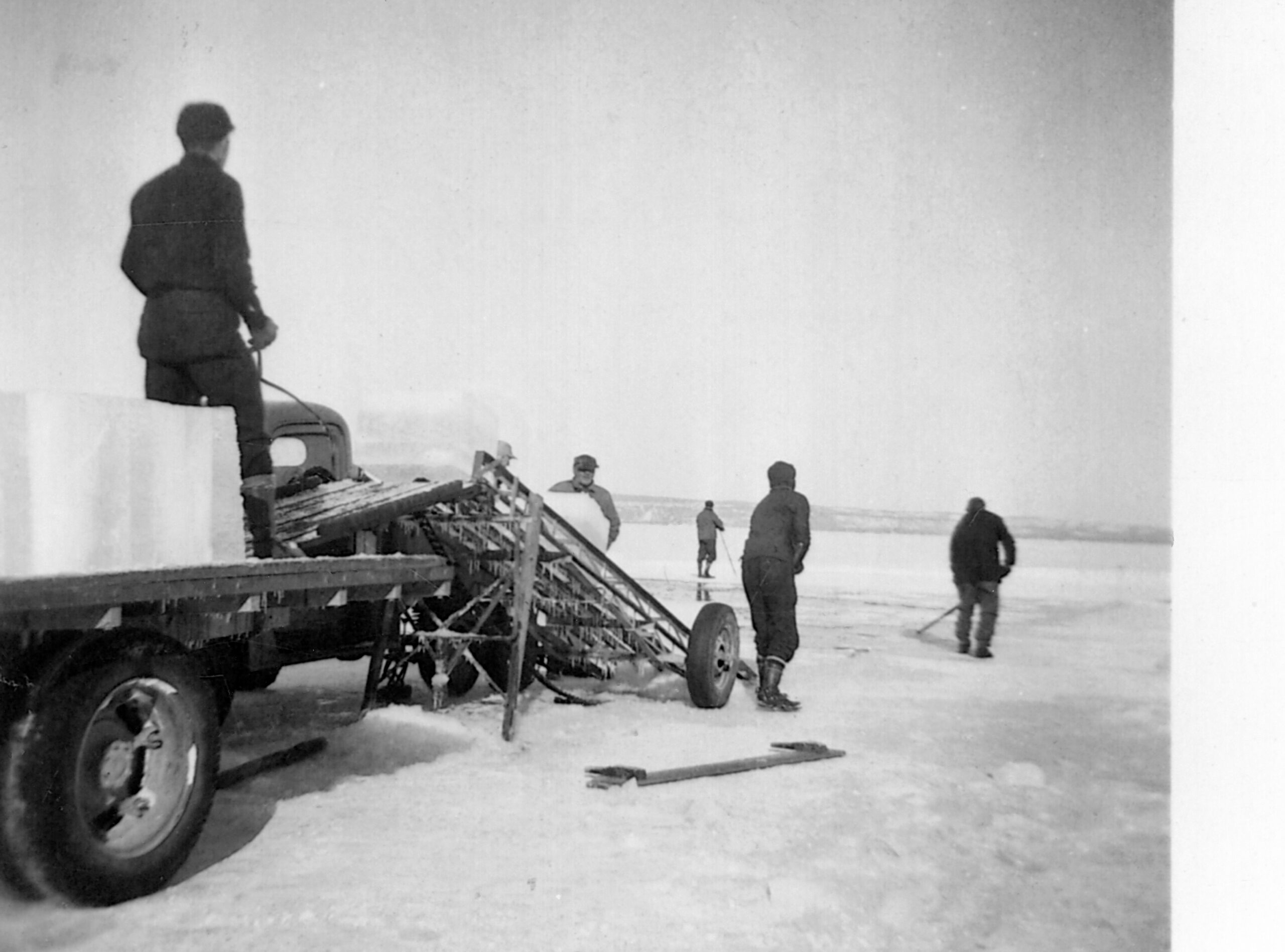 Men cutting ice blocks from St. Mary’s River for the LeBlanc Store in the Bay Mills Indian Community in Michigan, in the late 1930s or early 1940s.