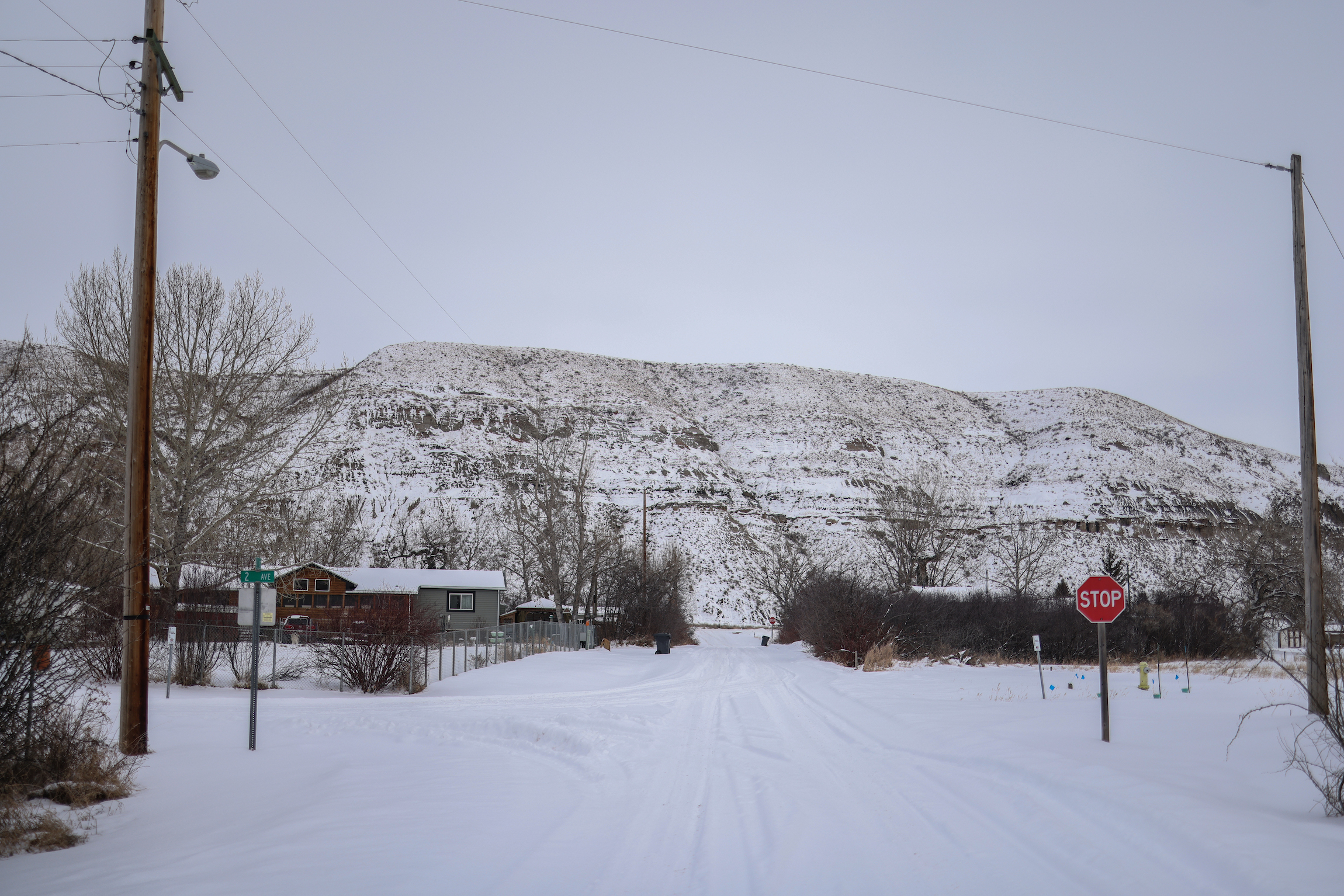 A sparsely populated community at the base of a snow-covered valley in Southern Alberta