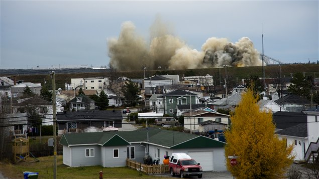 Dust and smoke from a blast at Malartic gold mine rises over the nearby town