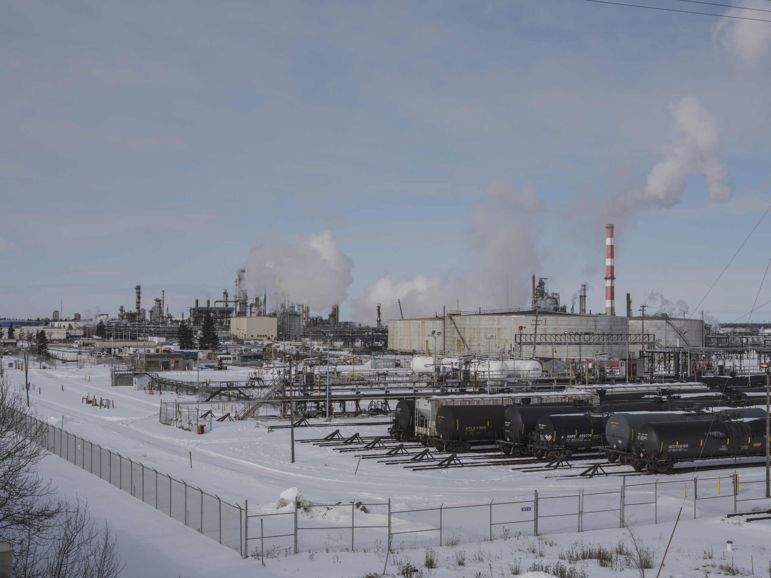 A full view of Imperial Oil refinery, with oil rail cars in the foreground. Refineries are among the facilities that are impacting the Edmonton air quality.
