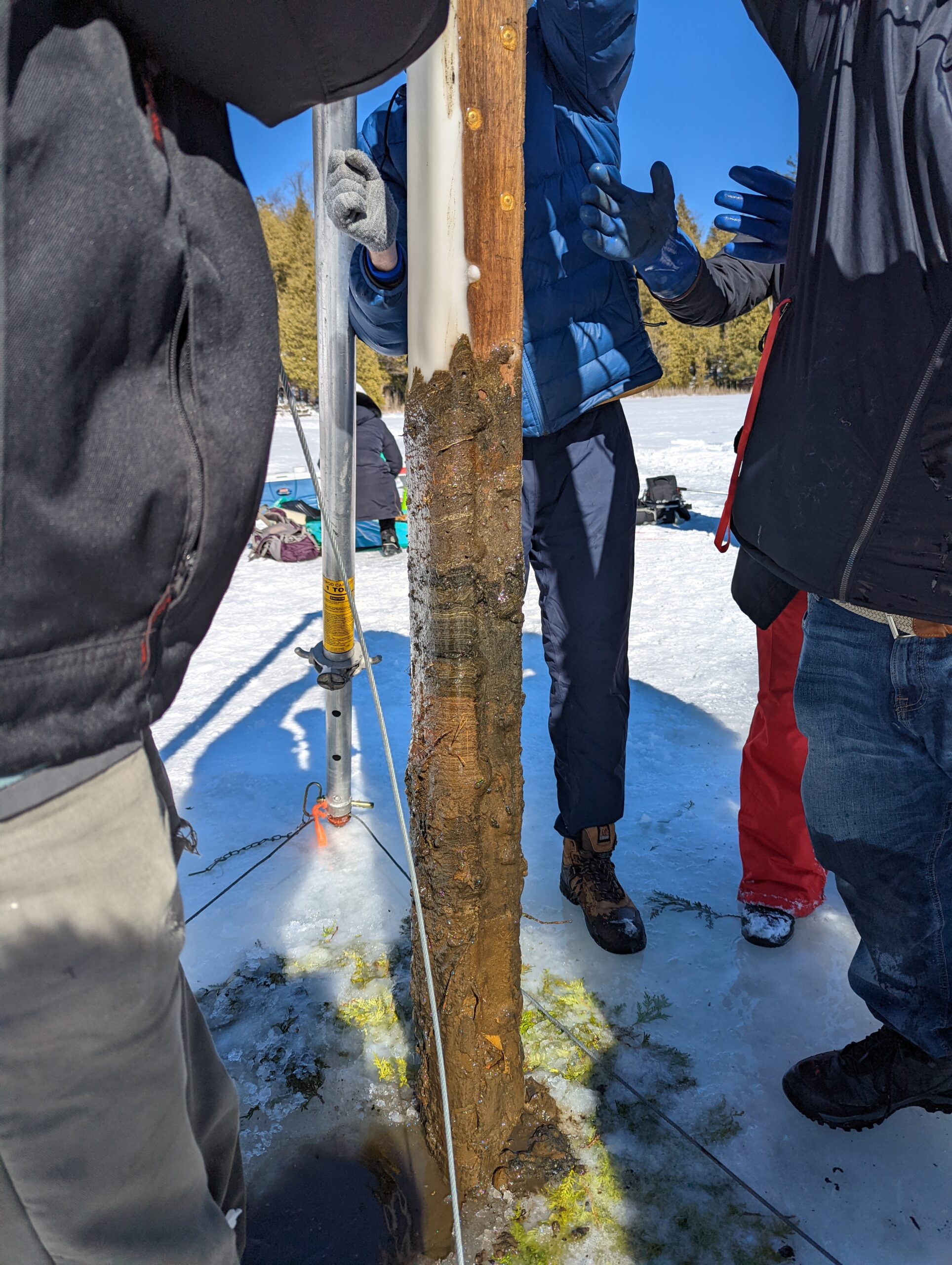 A team led by Francine McCarthy of Brock University pulls long freeze cores of sediment from Crawford Lake on the Niagara Escarpment. Photo: Conservation Halton