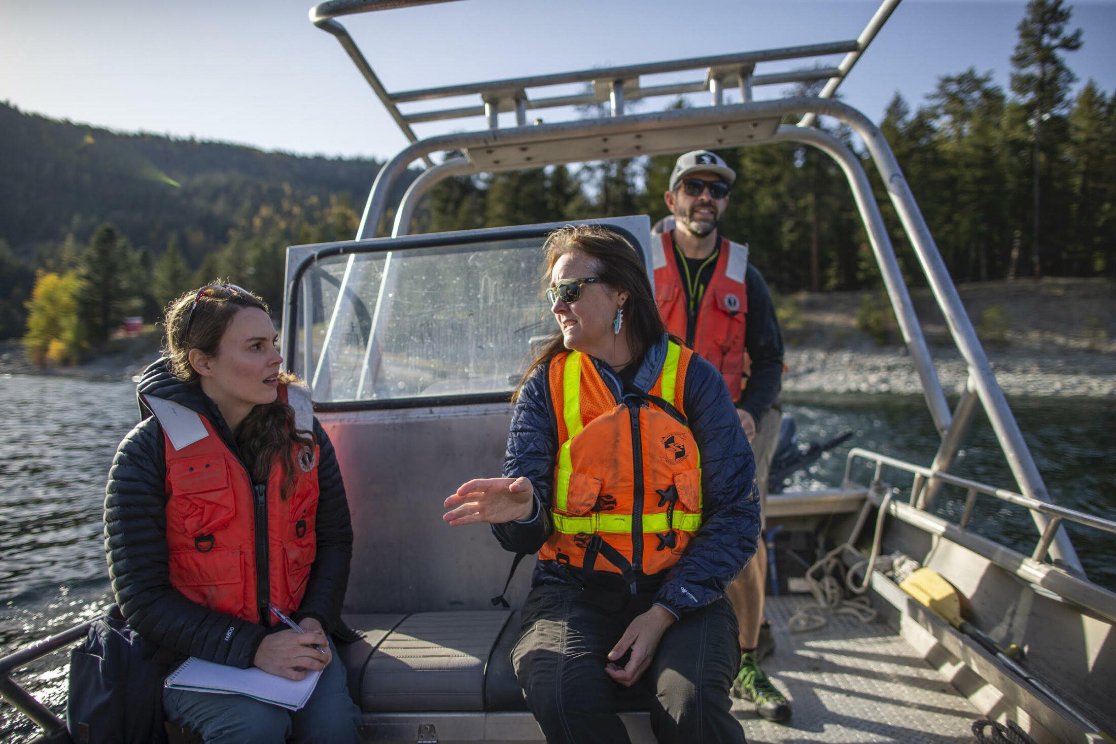 Reporter Ainslie Cruickshank speaking with Erin Sexton, a research scientist at the University of Montana's Flathead Lake Biological Station, on the Koocanusa Reservoir just above Libby Dam.