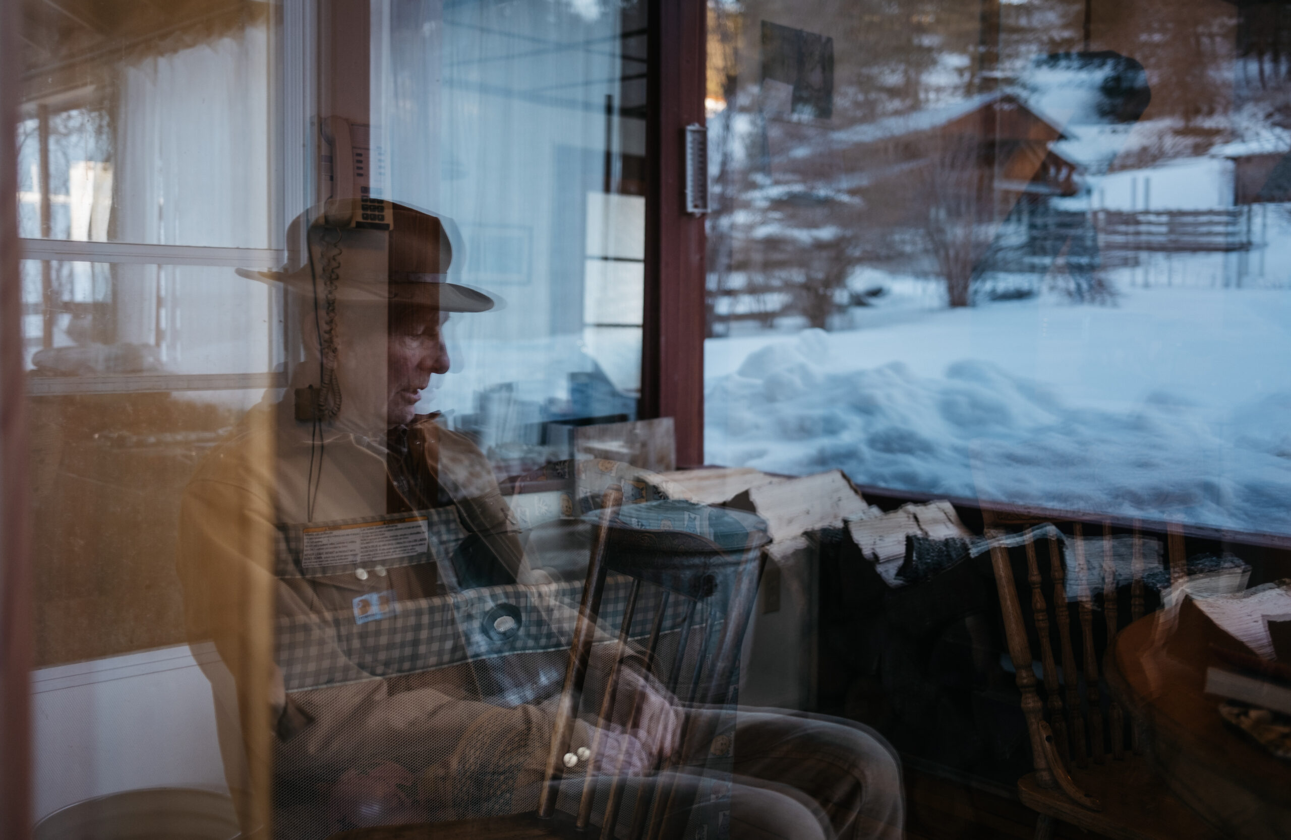 Forester Fred Marshall sits on the porch of his home outside Midway, B.C.