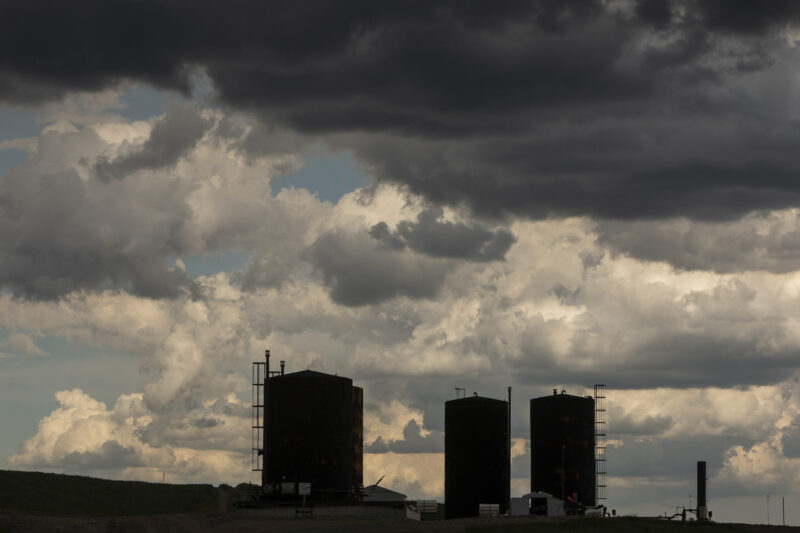 An inactive heavy oil production site run by Canadian Natural Resources Limited appears on the horizon near Lloydminster in southeast Alberta on June 12, 2022.