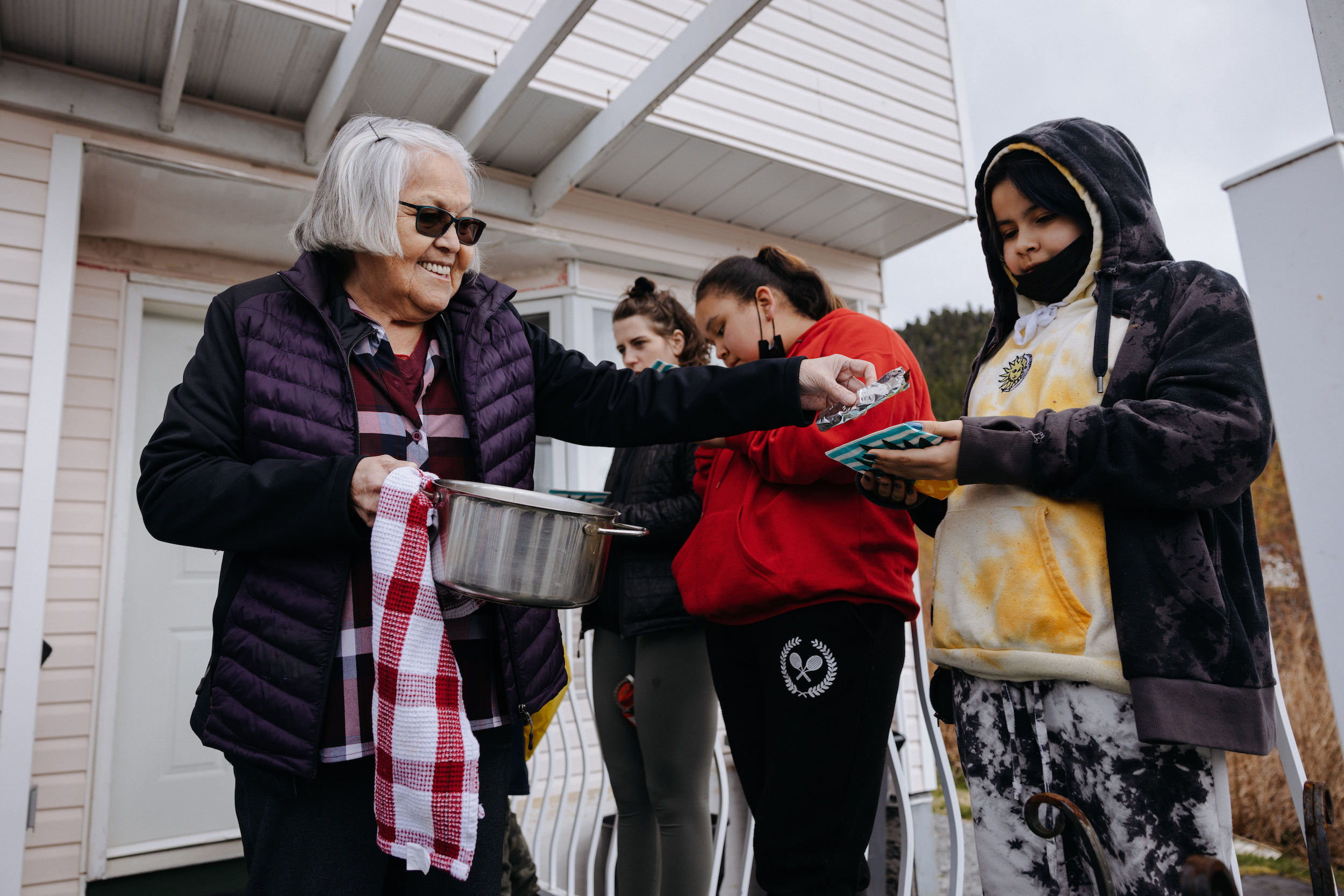 Nisga'a Elder Lavinia Clayton hands out oolichan