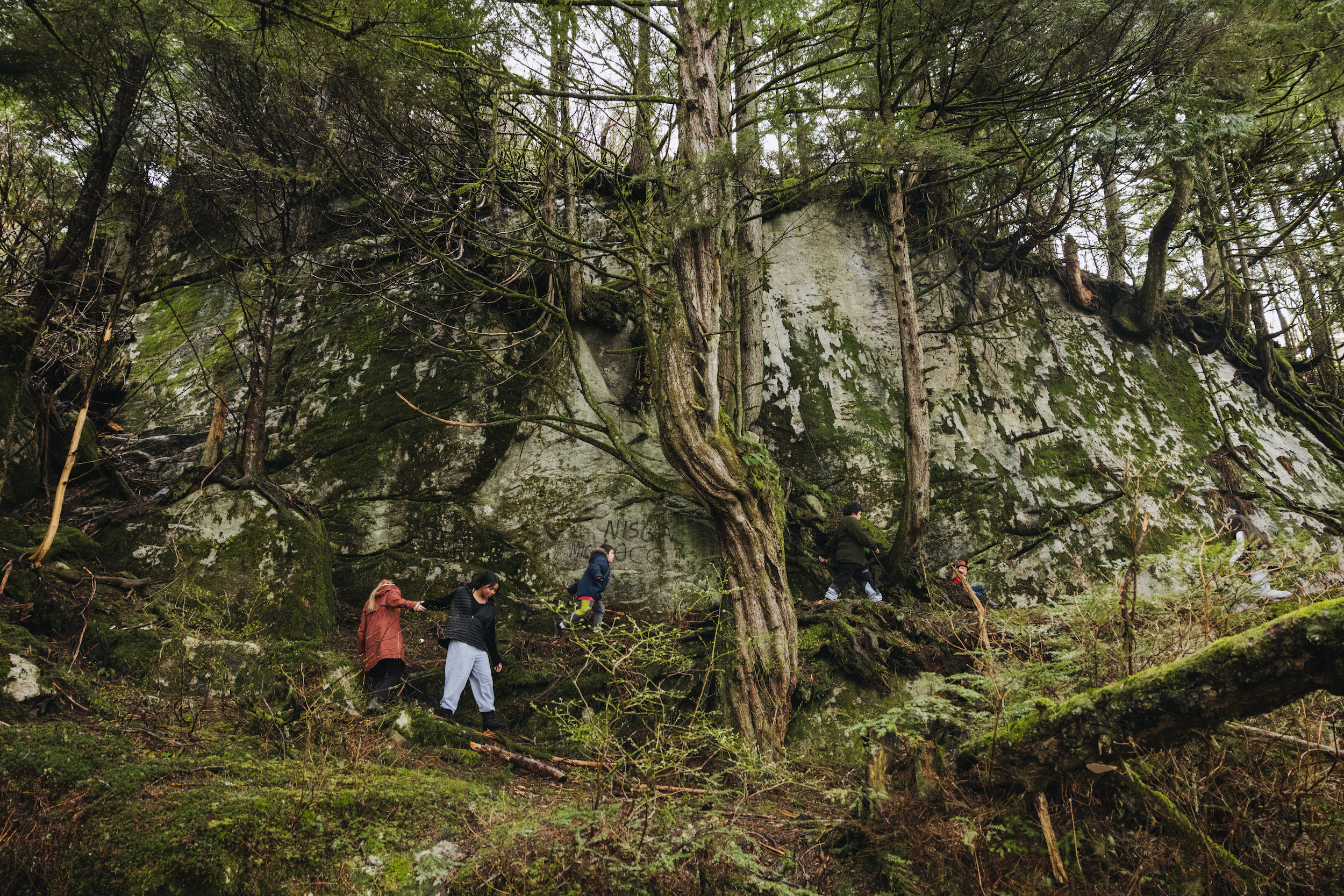 Nisga'a youth climbing in the village of Gingolx