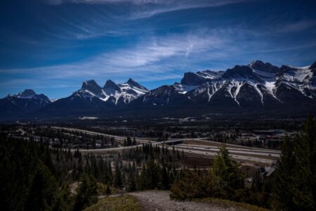 A view of the Town of Canmore and mountains in the background.
