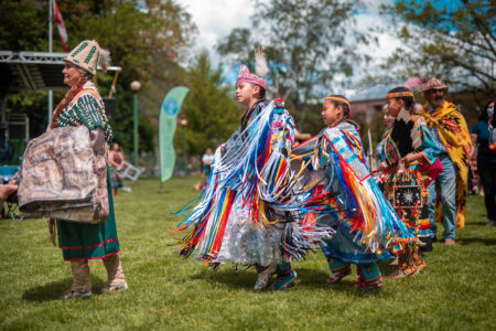 Sinixt dancers alongside Shelly Boyd at a celebration gathering in Nelson, B.C.