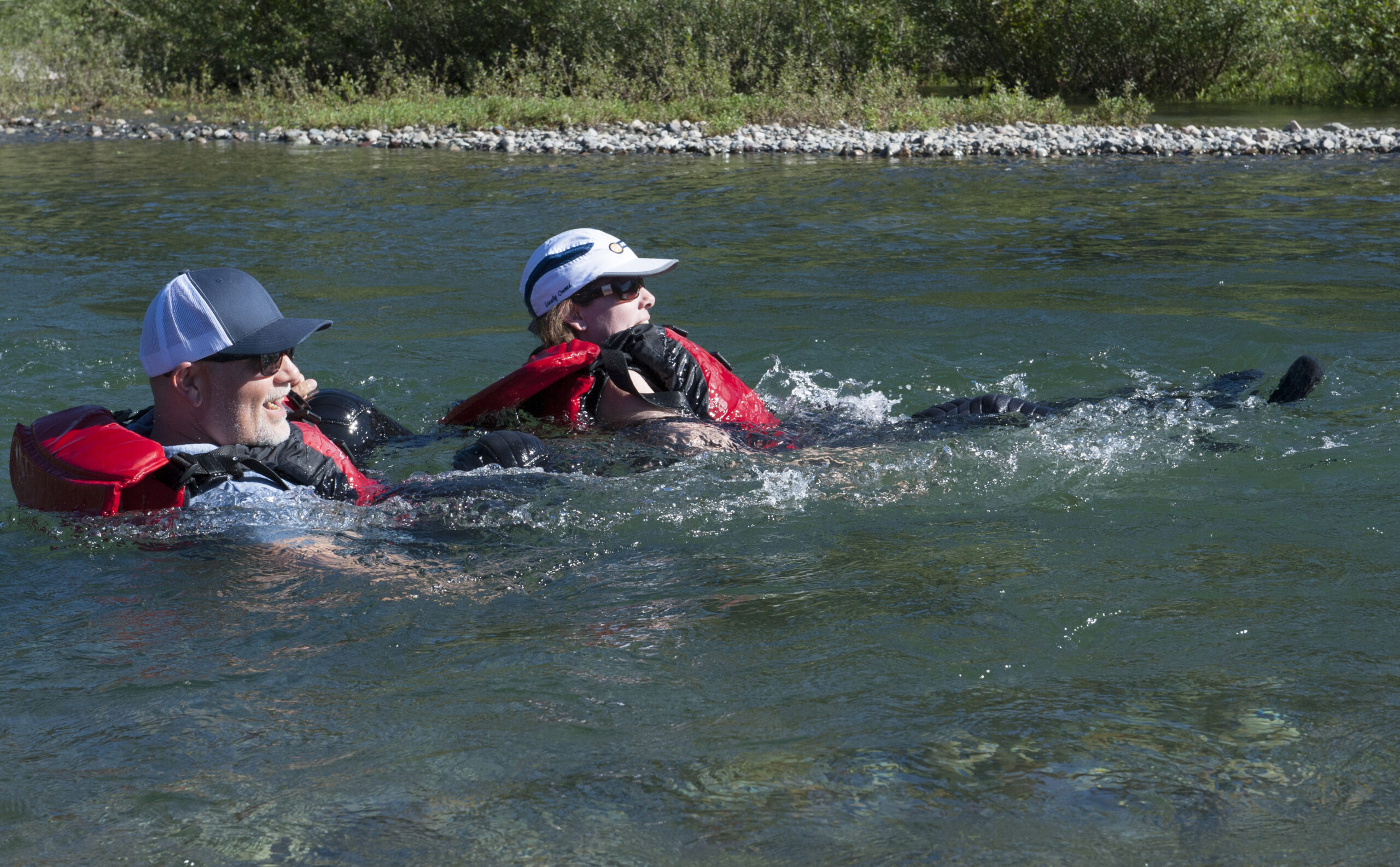 B.C. Green party members Adam Olsen and Sonia Furstenau cool off in the river.