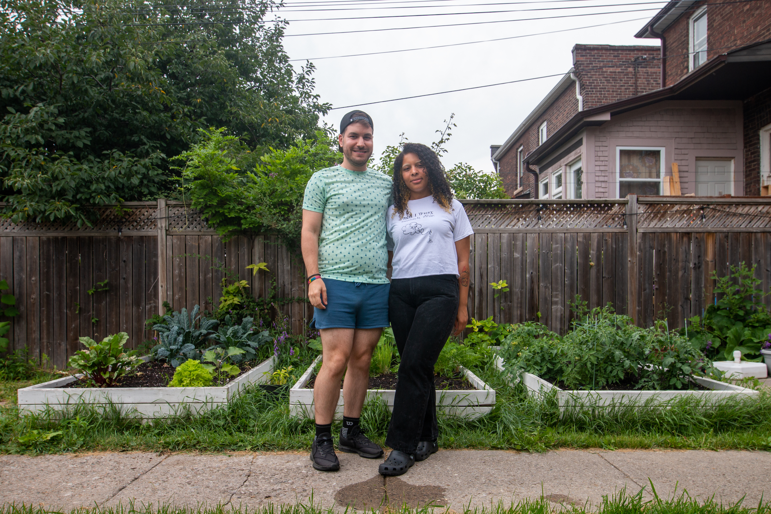 Marleigh Fox and Steve Perrotta in their backyard food garden in Toronto. Photo: Ramona Leitao / The Narwhal
