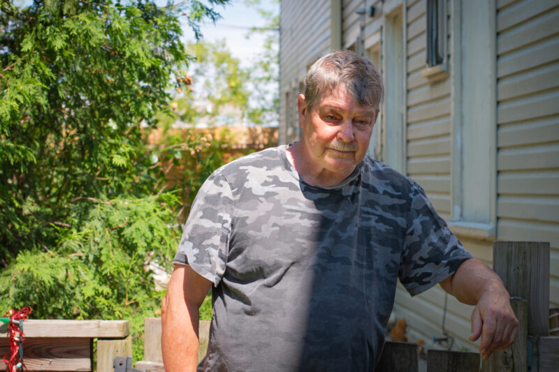 Glenn Brooks in his yard, which backs onto a former General Motors site in St. Catharines, Ont. Photo: Ramona Leitao / The Narwhal