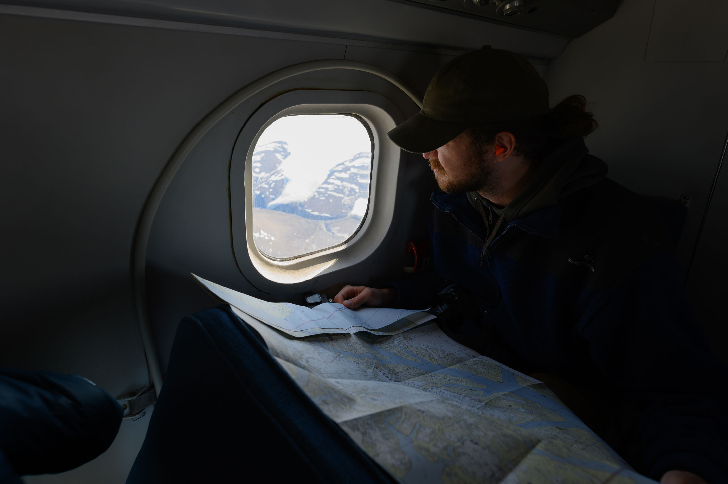 From the window of a Twin Otter, Erik Wagenaar, a master's student studying glaciology at Carleton University, looks out onto Ellesmere Island.