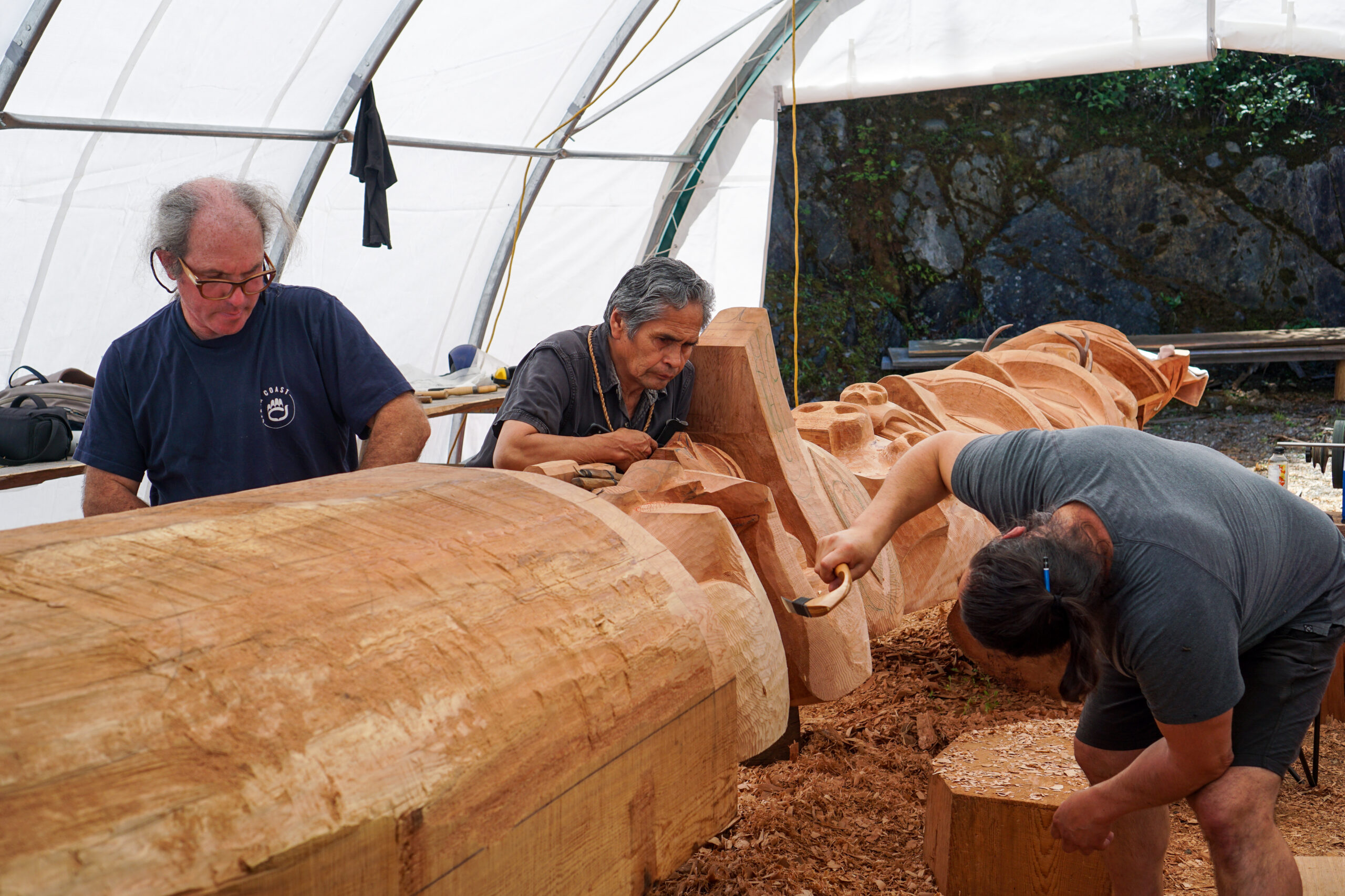 Joe Martin worked with several carvers on the totem pole, including Robinson Cook (left) and Gordon Dick.