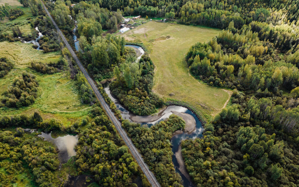 Aerial view of CN rail line, Upper Bulkley River and a local farm