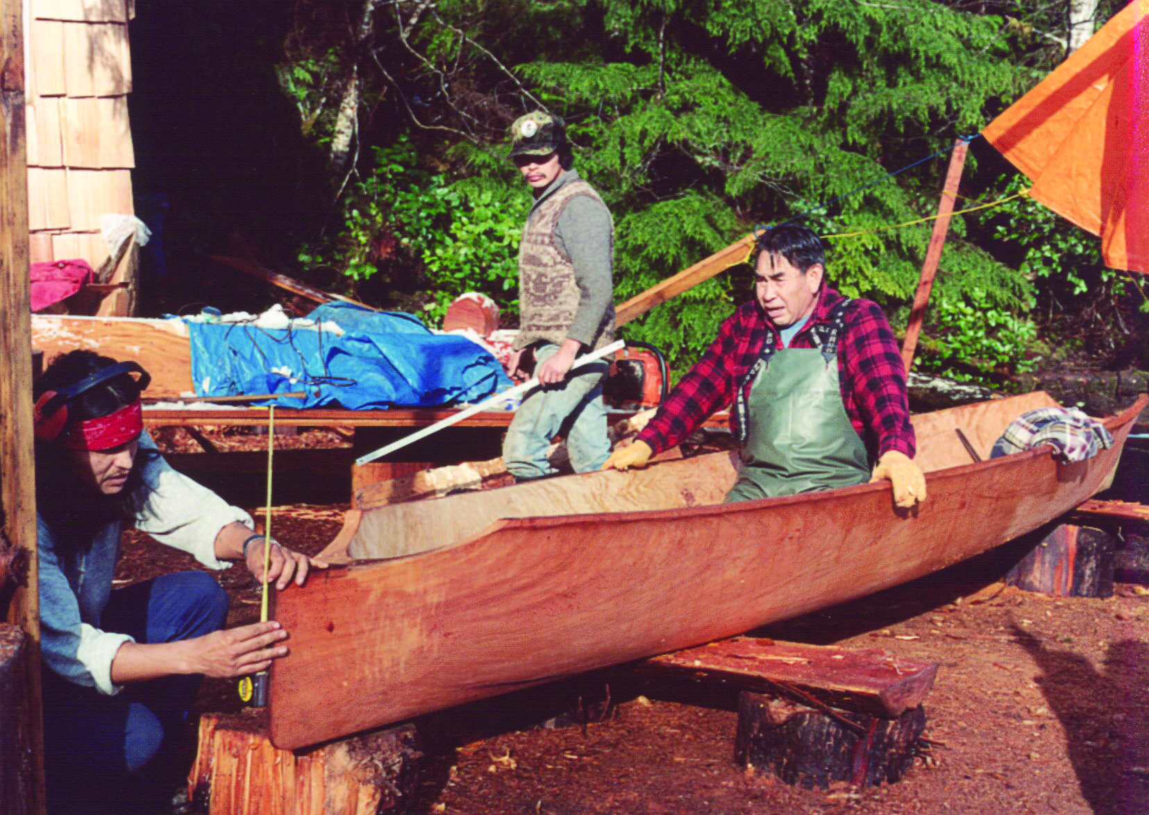 Joe Martin (centre) with his brother Bill Martin (left) and father Chief Robert Martin Sr. carved three canoes together while obstructing MacMillan Bloedel from cutting down old-growth forest on Meares Island in 1984. Photo: Leigh Hilbert