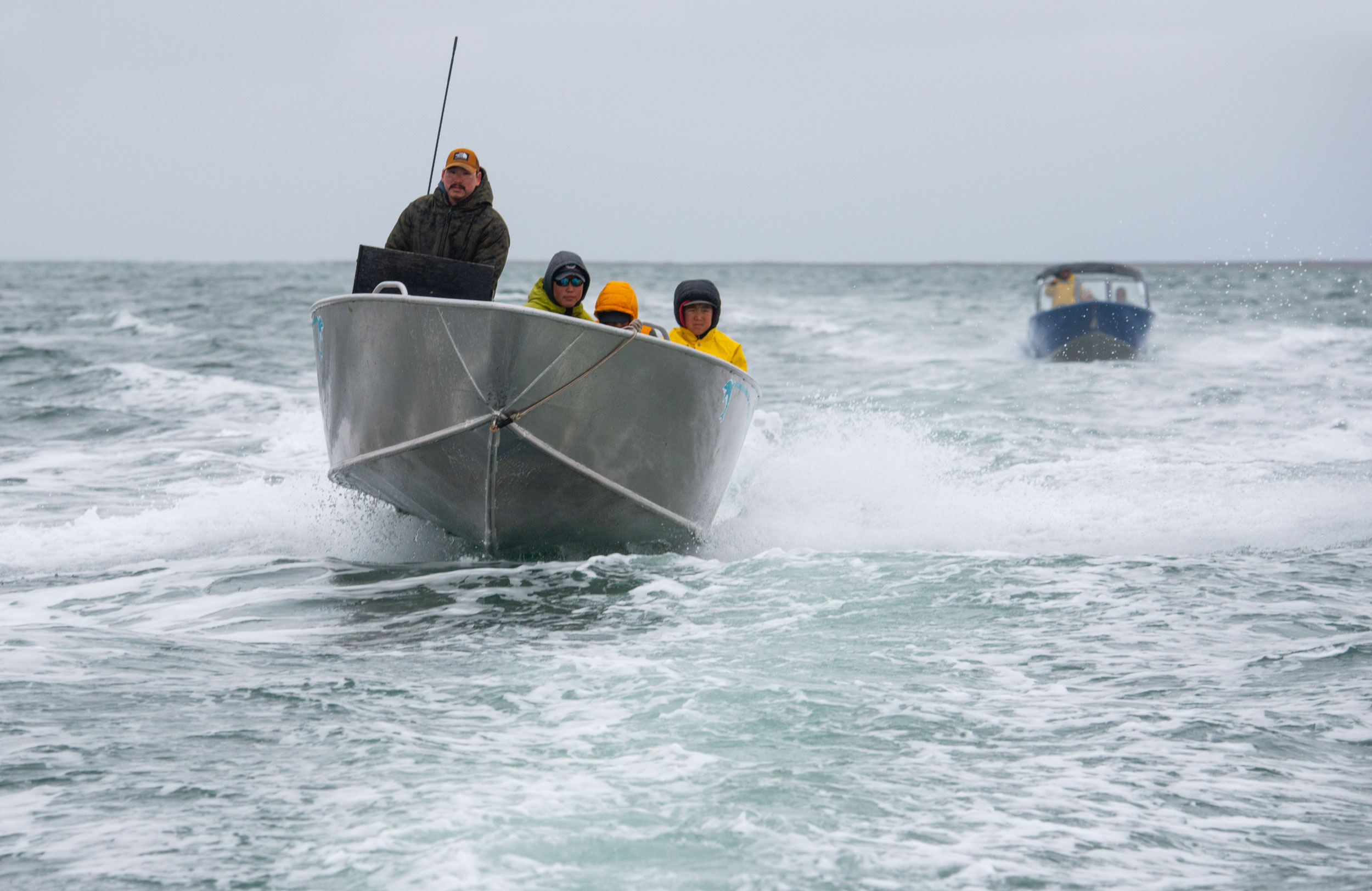 Leaders and participants in the Young Hunters program zip around Hudson Bay in pursuit of belugas.