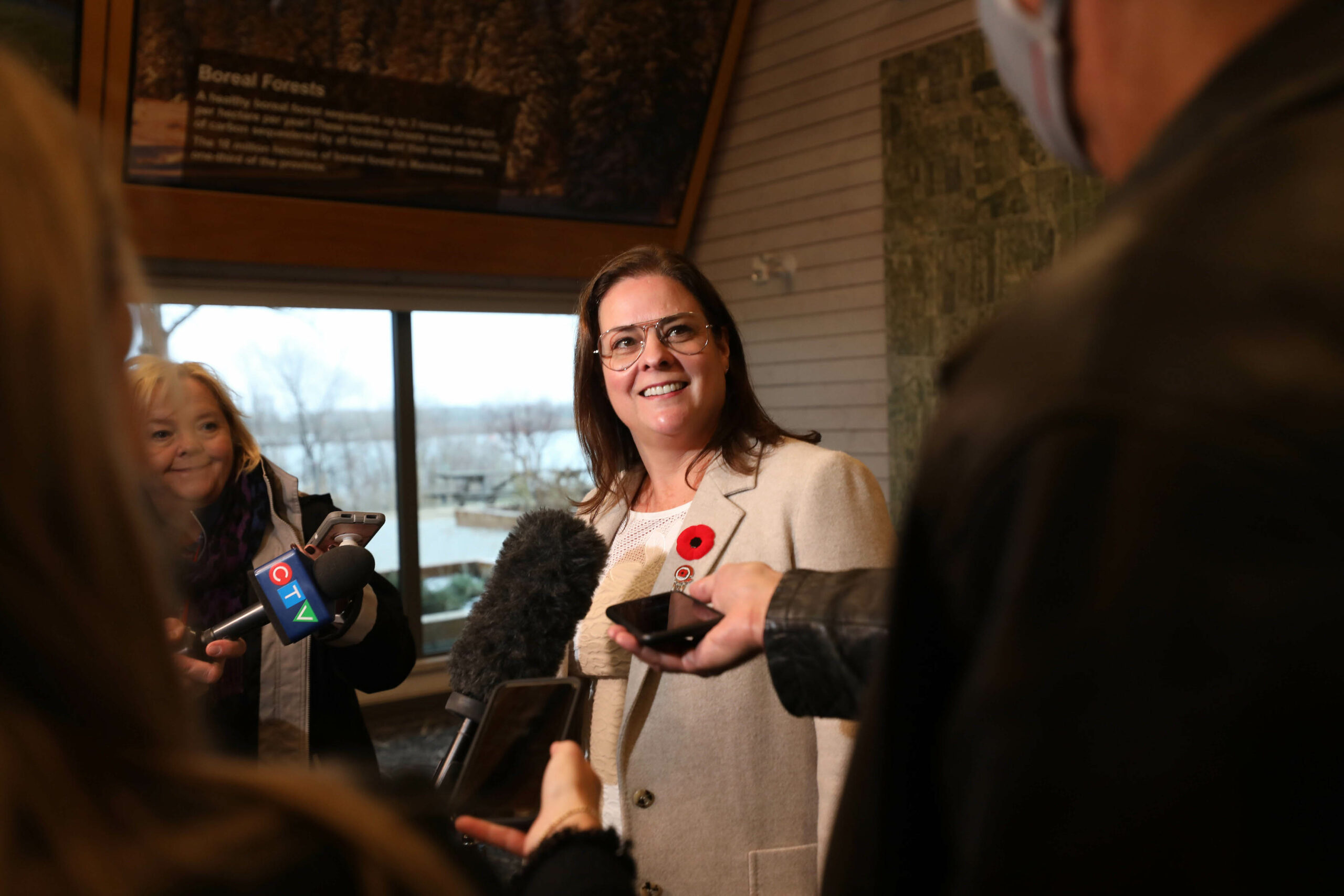Manitoba Premier Heather Stefanson stands behind reporters while announcing provincial water strategy