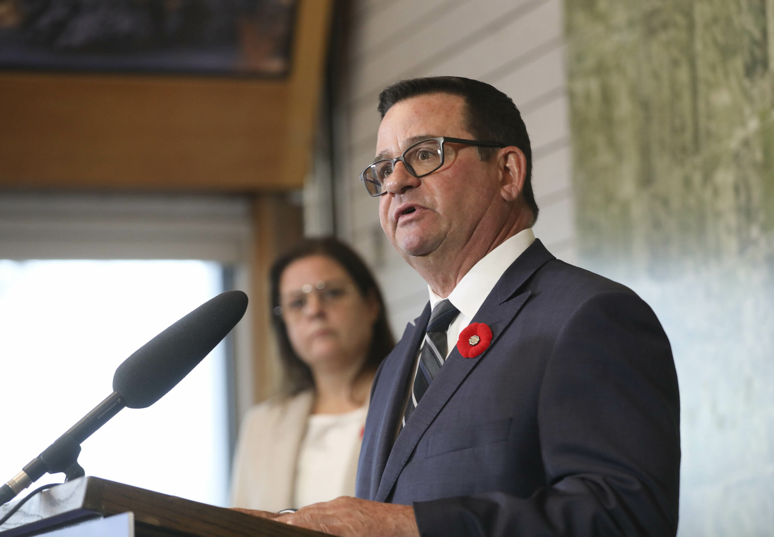 Minister Jeff Wharton wears a dark suit while making an announcement. Wharton and Premier Heather Stefanson have touted Manitoba as a mining destination.