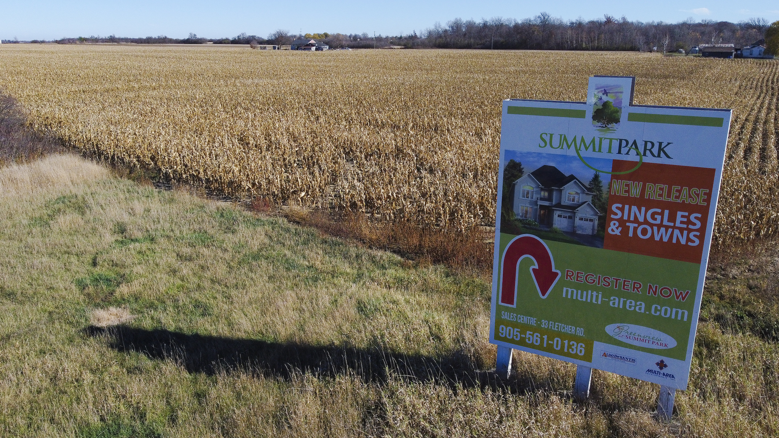 A farm with a sign advertising a subdivision in Stoney Creek, Ont.