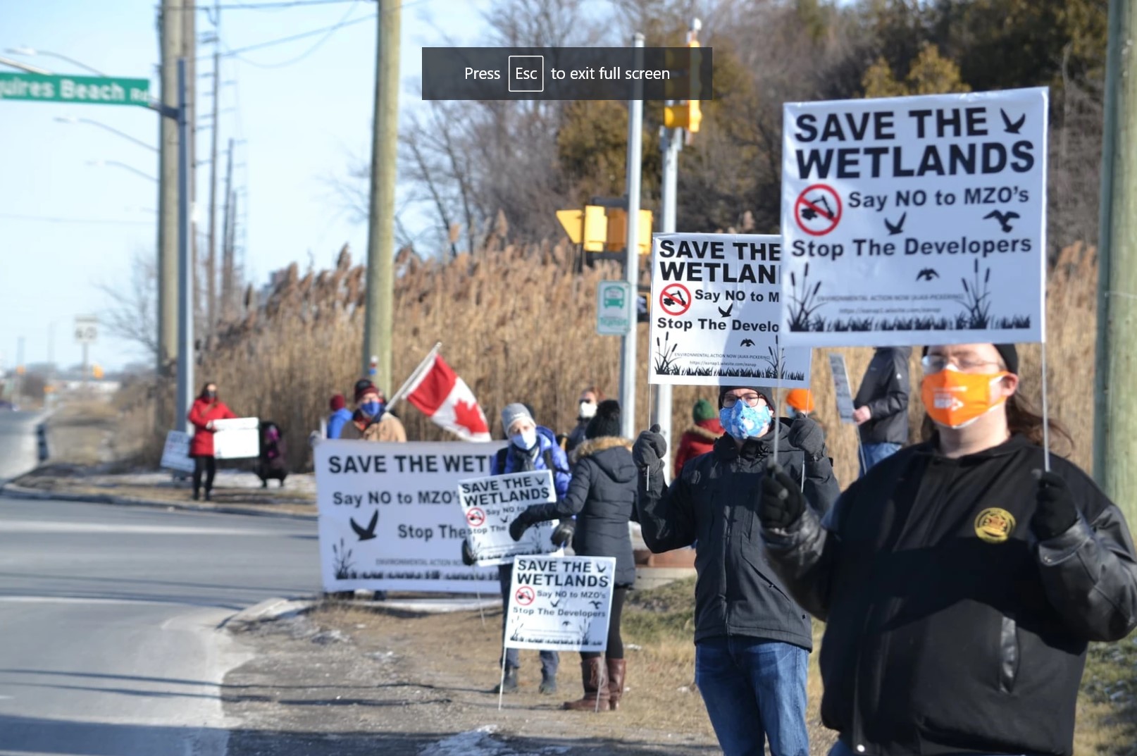 People protesting a government order to develop wetland in Pickering